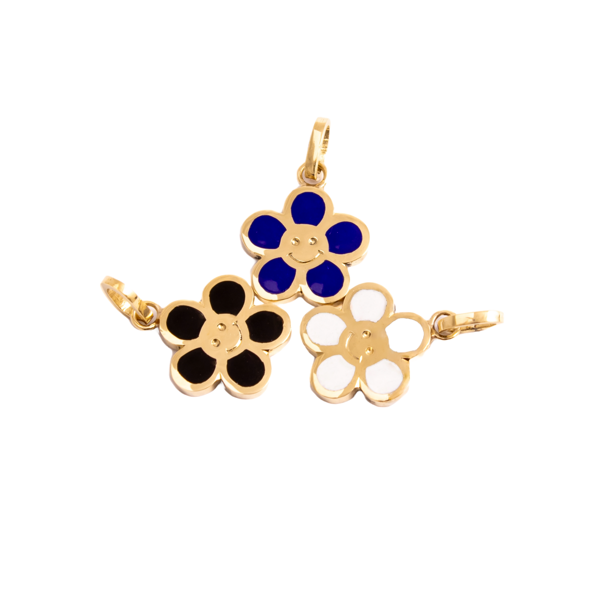 a set of 3 happy pendants, flower shpaeed with a smiley in the center, colors blue , white, black