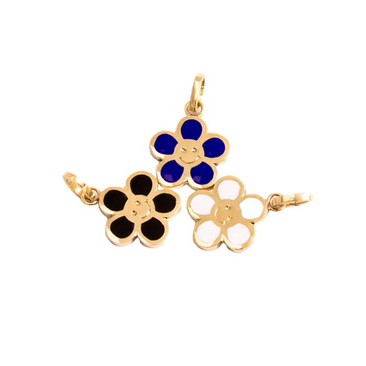 a set of 3 happy pendants, flower shpaeed with a smiley in the center, colors blue , white, black